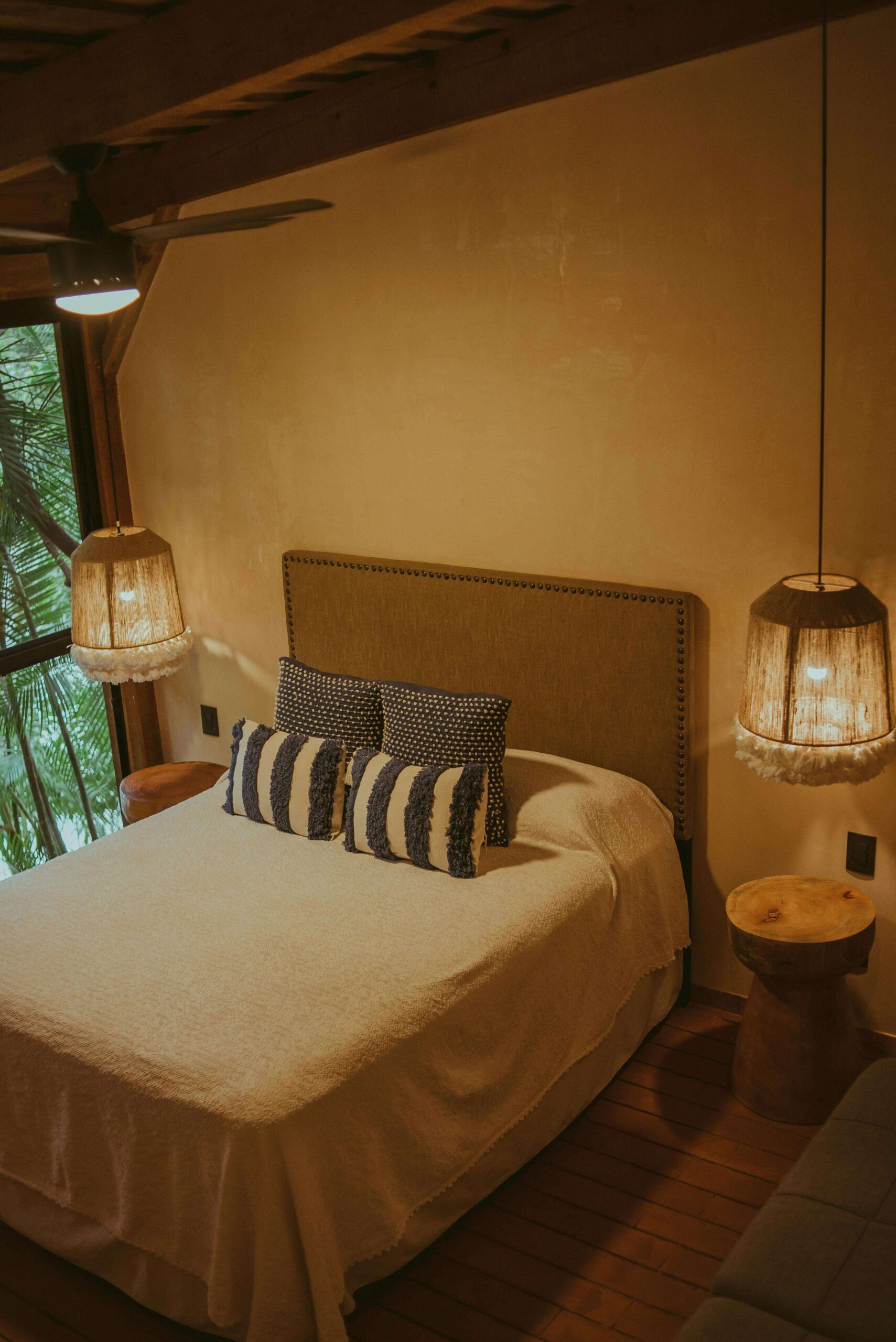 bed room with hang lights