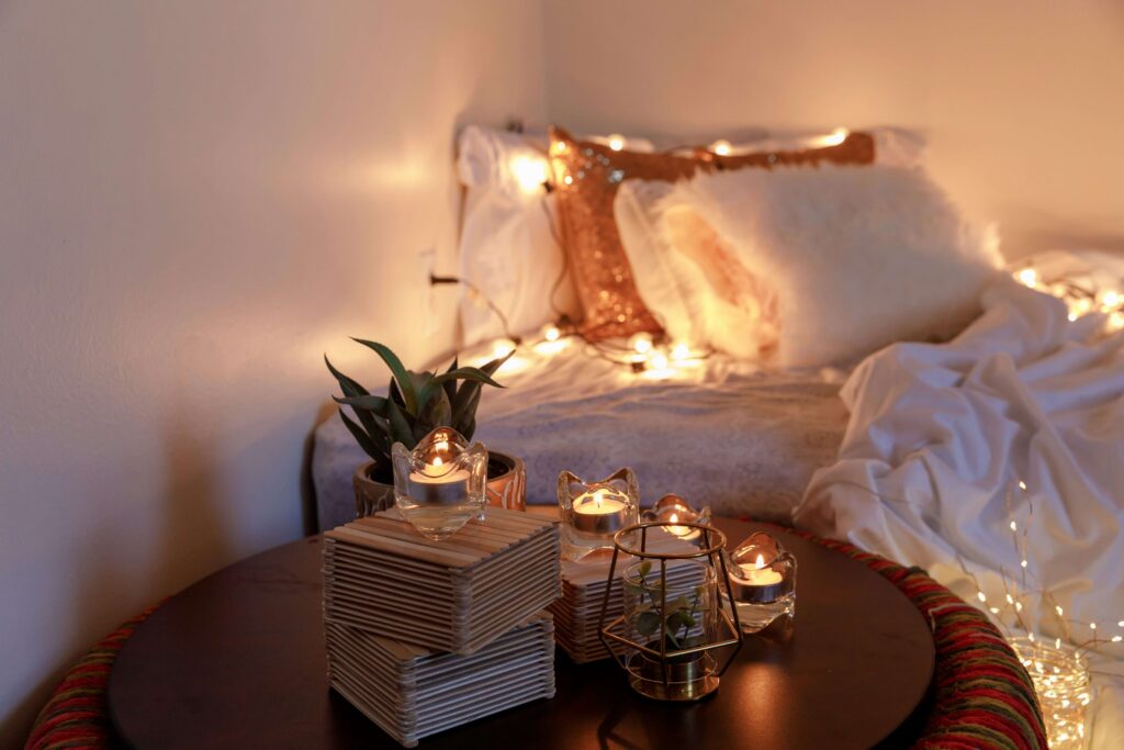 a room with yellow light and pillows
